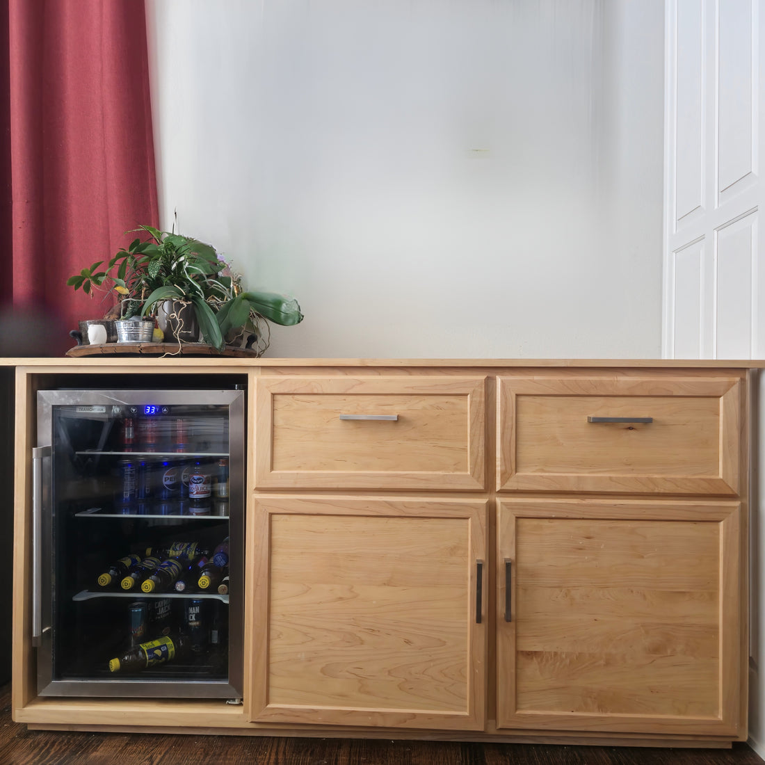 wooden mini bar cabinet with a glass section 